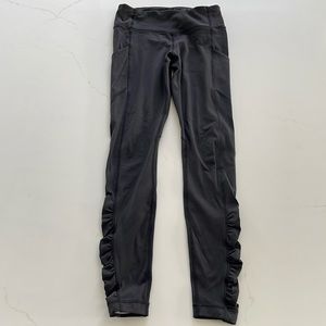 Lululemon athletica black womens leggings with side pockets and rouche detail